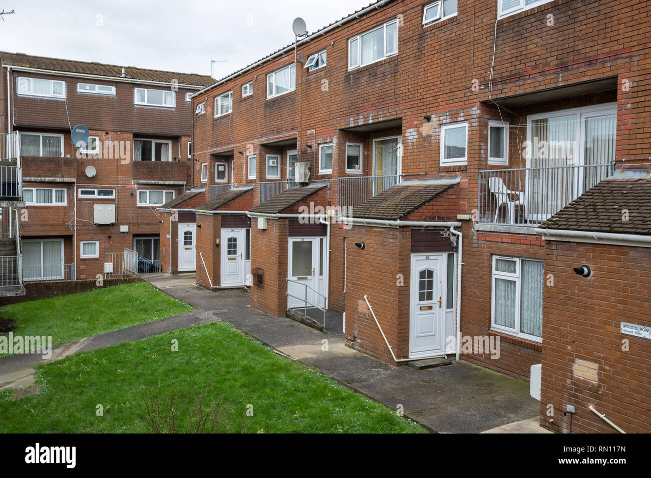 White Front Doors At A Block Of Affordable Cheap Council Houses In The Heart Of Carmarthen Town Center In Wales Stock Photo Alamy