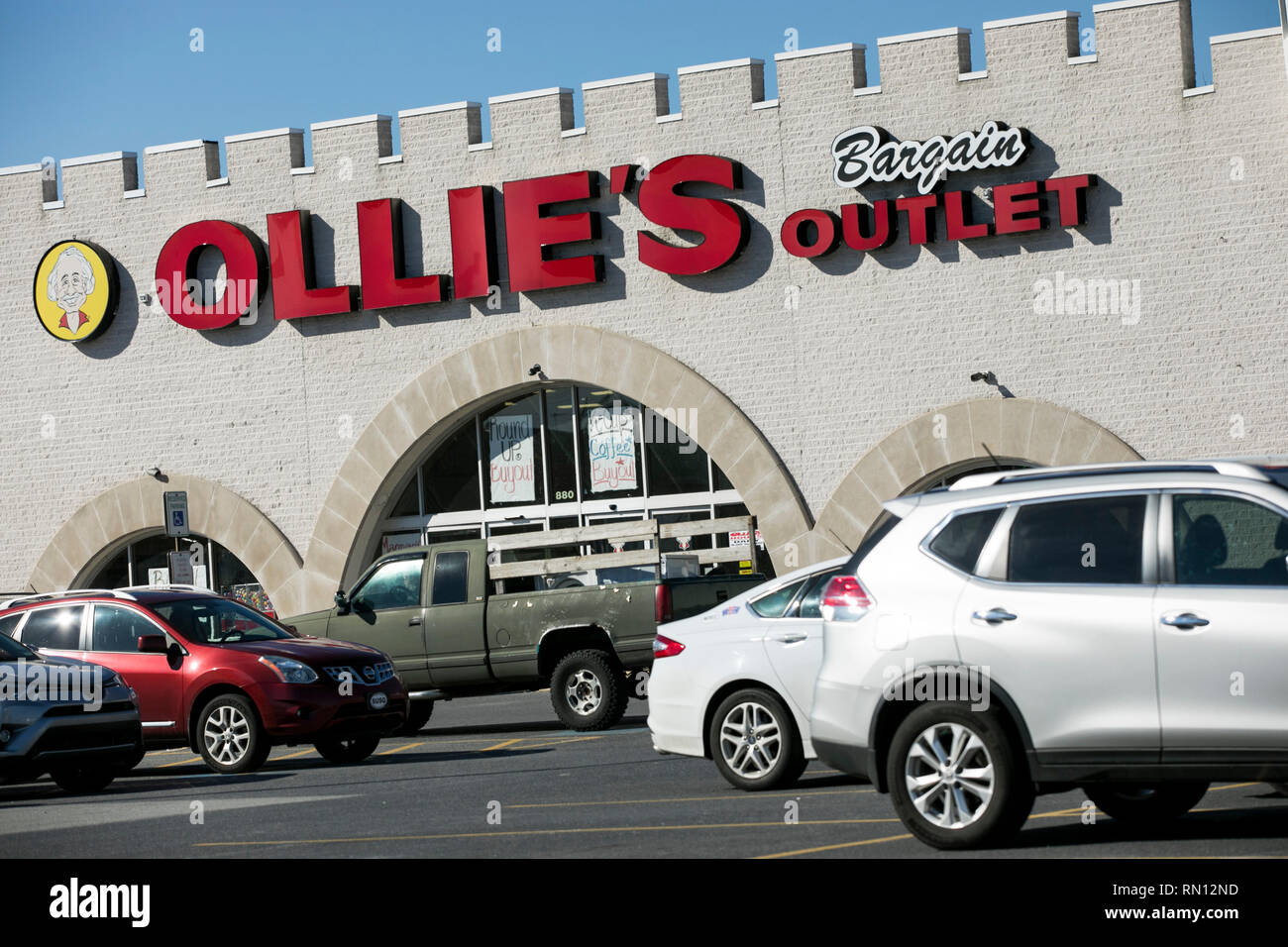 A logo sign outside of a Ollie's Bargain Outlet retail store in