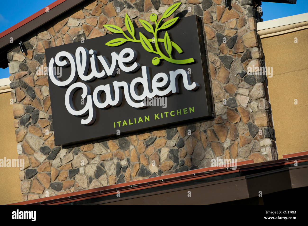 A logo sign outside of a Olive Garden restaurant location in Harrisburg, Pennsylvania on February 9, 2019. Stock Photo