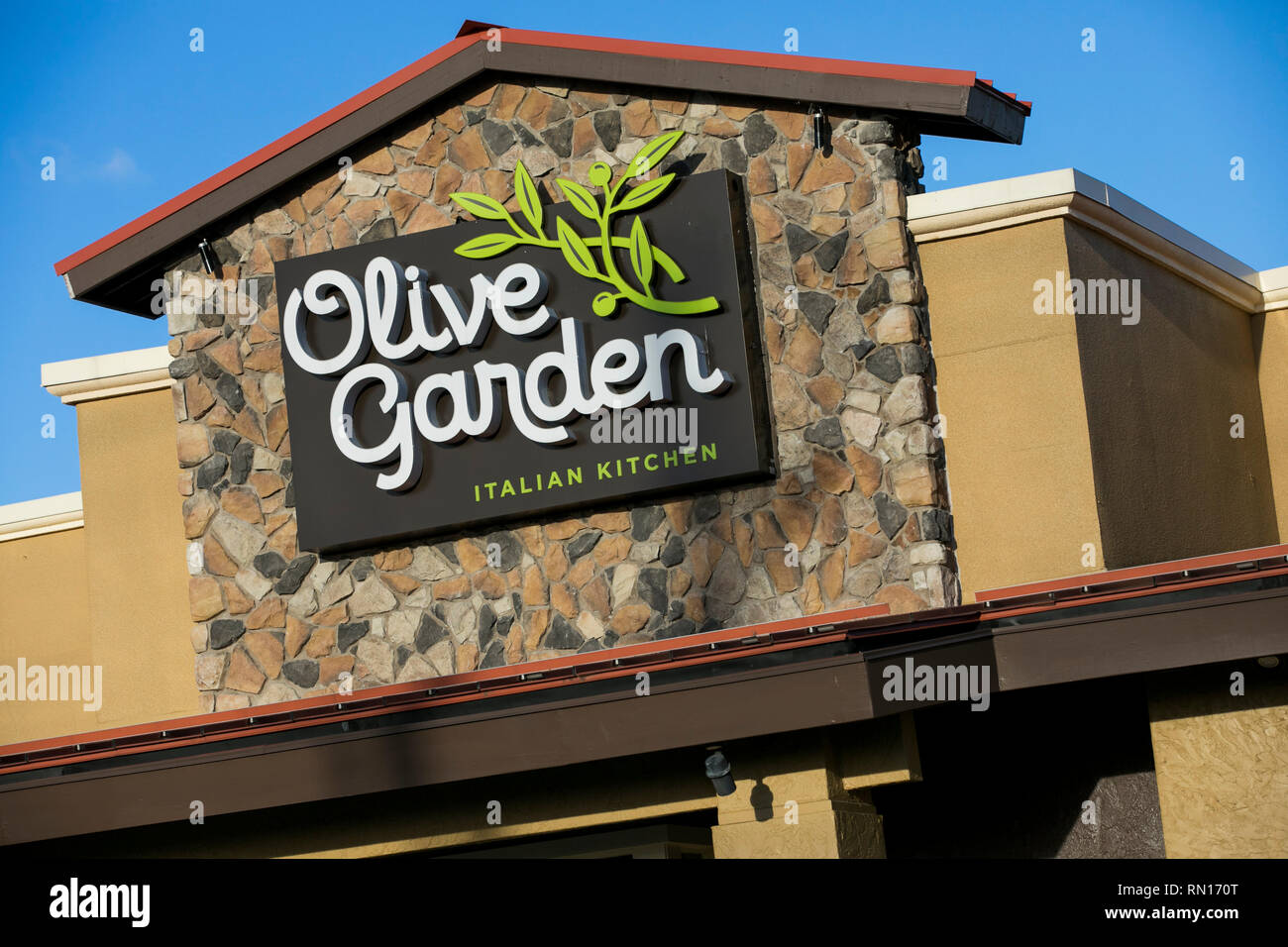 A logo sign outside of a Olive Garden restaurant location in Harrisburg, Pennsylvania on February 9, 2019. Stock Photo