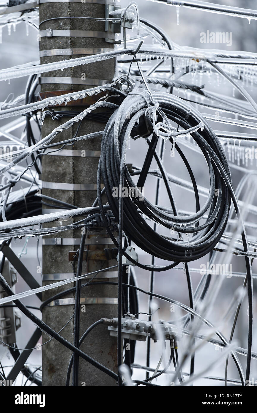 Electricity cables covered in ice after frozen rain phenomenon Stock