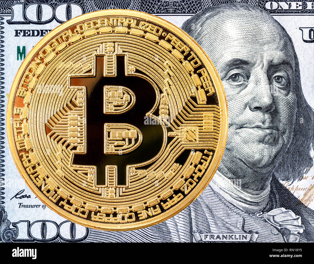 Bitcoin on the banknote of 100 american dollar, detail. Business concept of  worldwide digital money Stock Photo - Alamy