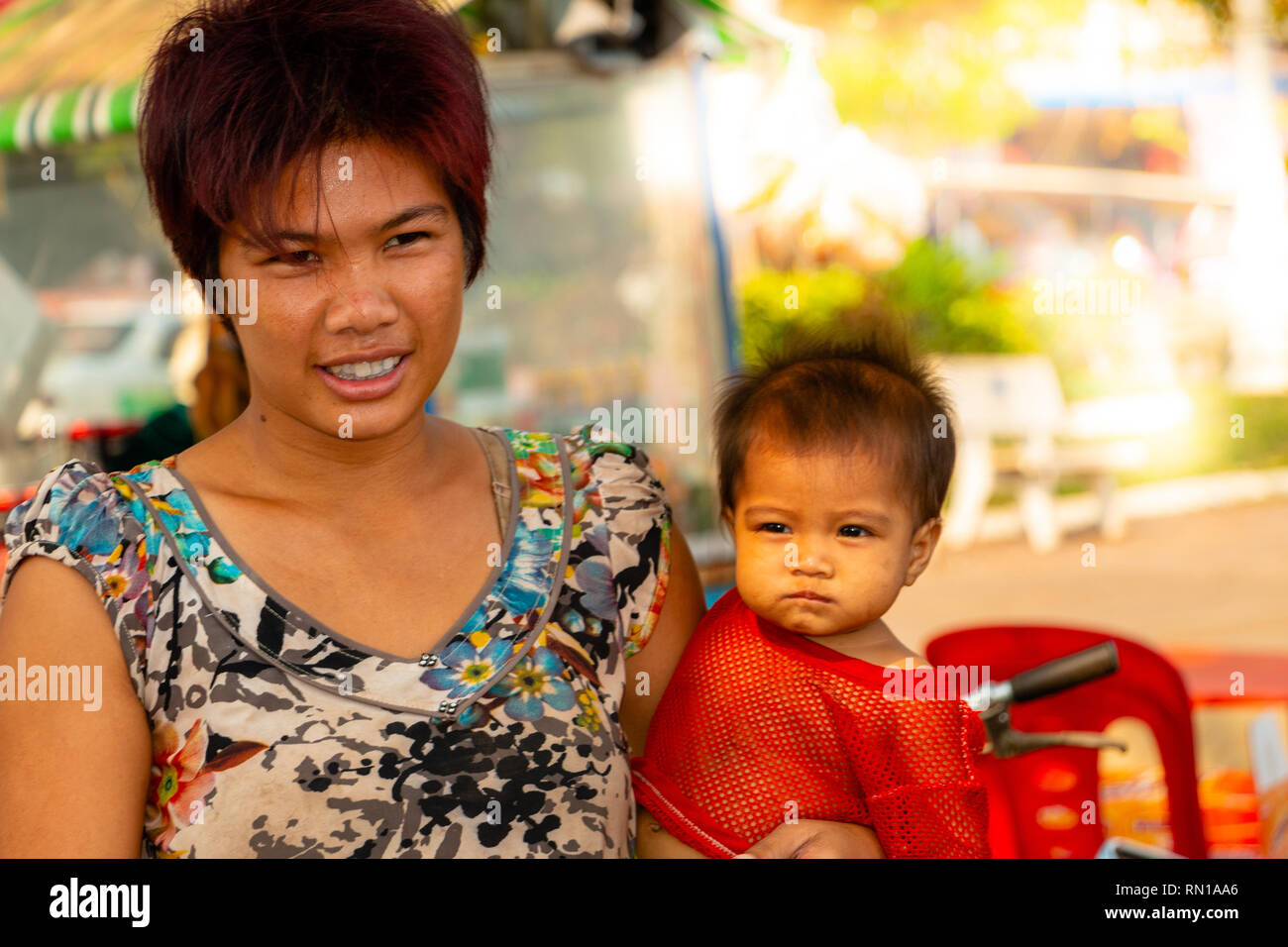 Young Cambodian mother and pre school age child smile for the camera  Kampong Tralach, Oudong, Cambodia, Asia Stock Photo