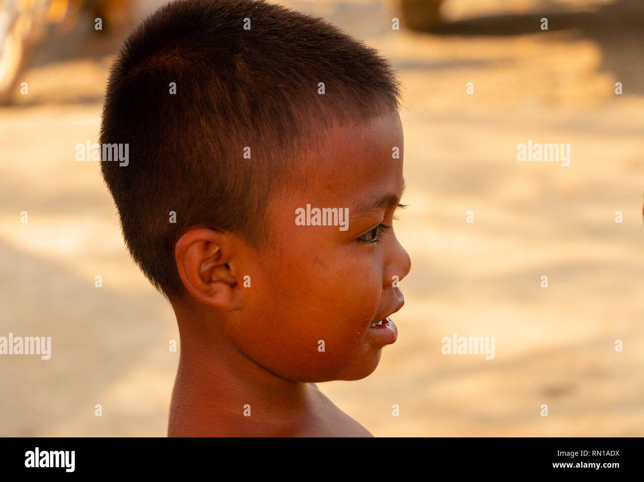 Portrait of a cute, happy,smiling, young, local,   primary school age Cambodian child  Kampong Tralach, Oudong, Cambodia, Asia Stock Photo