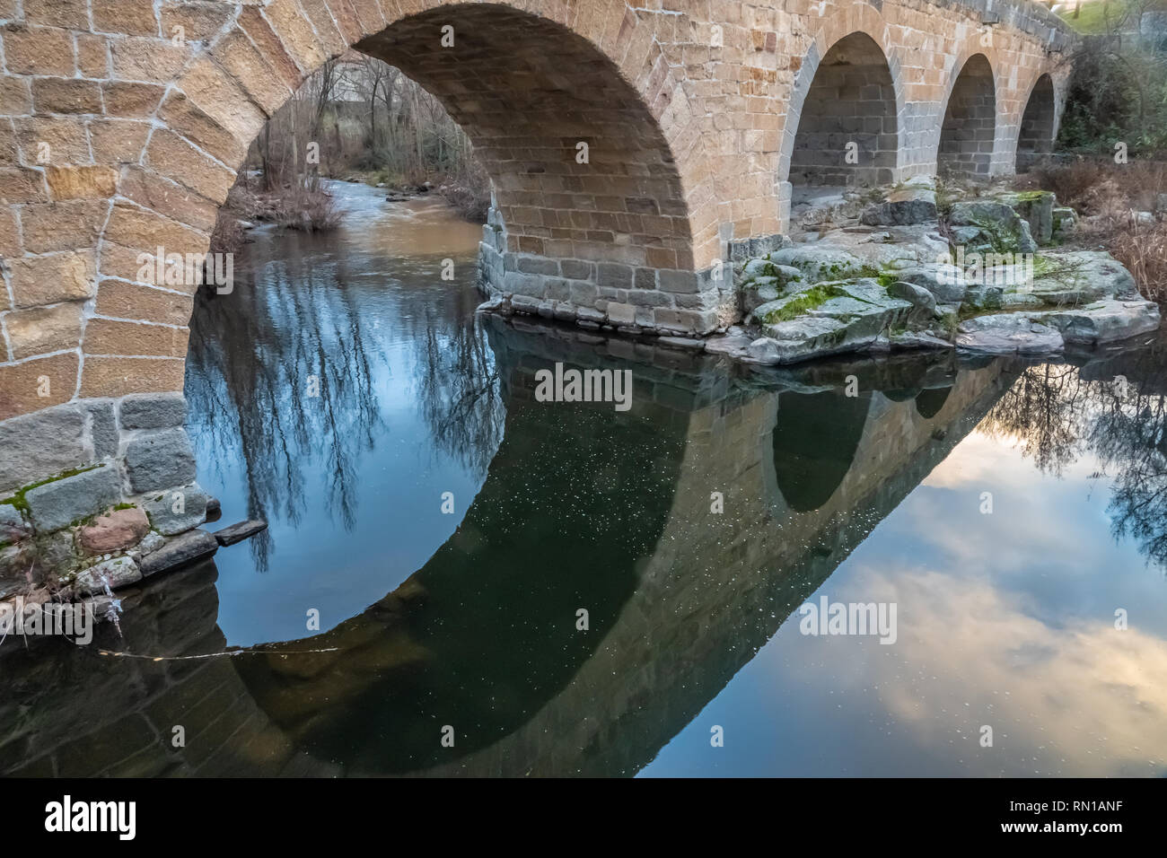 The Roman bridge of Avila (Puente Romano de Avila), Castile-Leon, Spain. Built in the 1st century, spanning the Adaja River on a route leading to the  Stock Photo