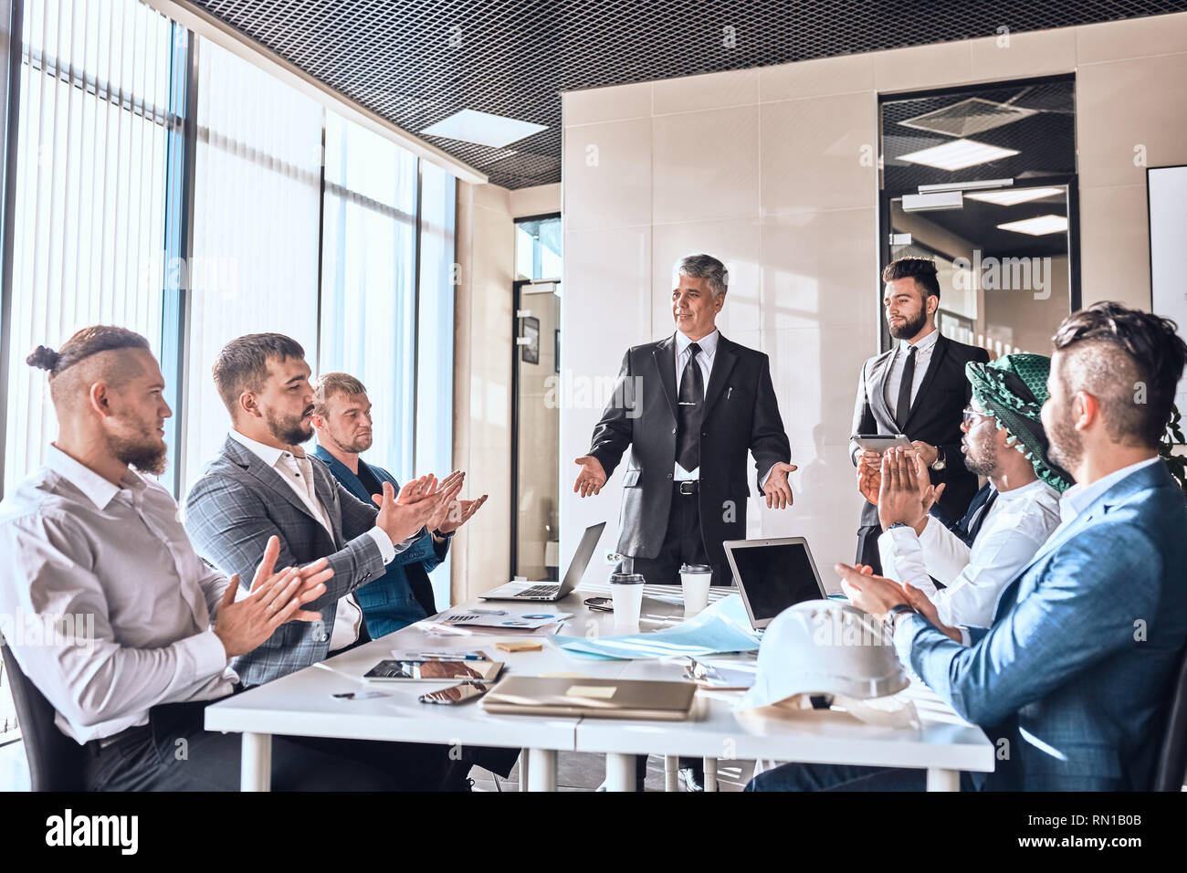 positive business people having a formal meeting summit conference ...