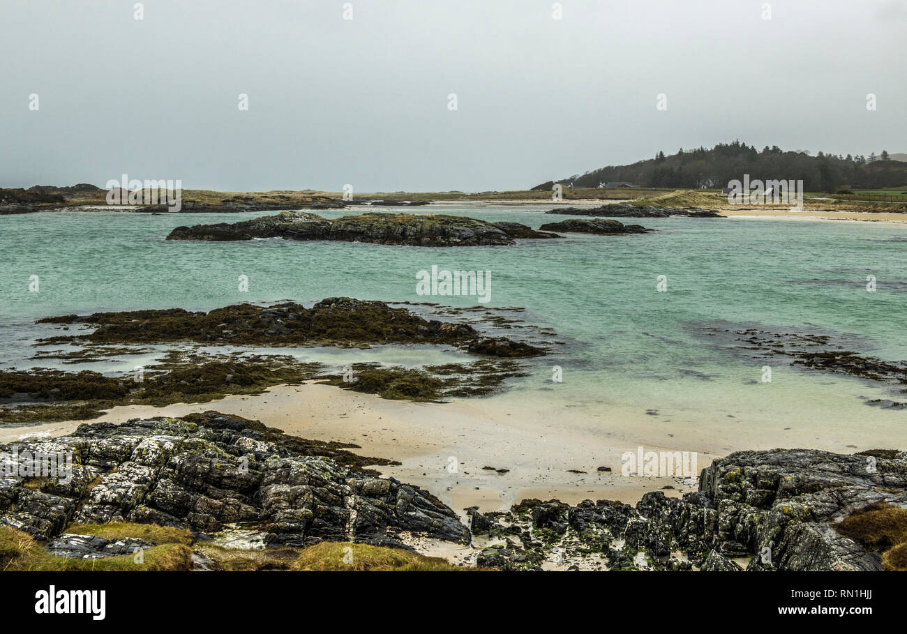 Traigh Beach on the west Scottish Coast near Mallaig, photographed on a dull weather day but still with plenty of detail of the rocks, sand and sea. Stock Photo