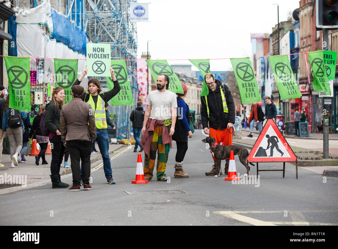 Turbo Island. Bristol, UK. 16th February 2019. Extinction Rebellion protesters in Bristol hold a street party in Stokes Croft to highlight Bristol City Council's inaction to prevent climate change.  Several hundred protesters blocked off Stokes Croft and surrounding roads.  A DJ played music from a scaffold tower on Turbo Island. Bristol, UK. 16th February 2019. Stock Photo
