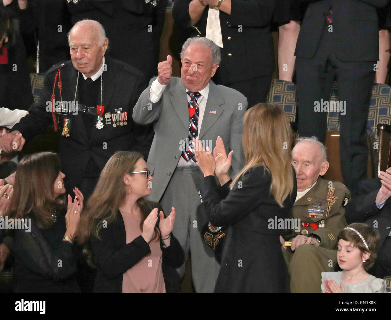 Washington DC, USA. 5th February 2019. Herman Zeitchik, who was among the 4th Infantry Division soldiers who landed at Utah Beach early on the morning of June 6, 1944, left, Irving Locker, who landed at Utah Beach on D-Day with the 116th AAA gun battalion, center, and Joseph Reilly, who parachuted behind enemy lines with the 101st Airborne Division the night before D-Day, seated at right, are recognized by United States President Donald J. Trump for their contributions during World War II as he delivers his second annual State of the Union Address to a joint session of the US Congress in the U Stock Photo