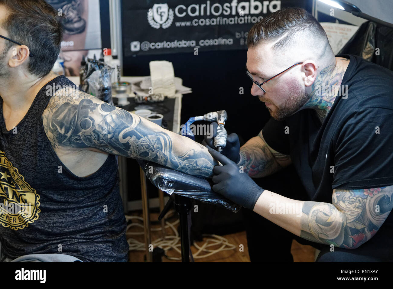 Paris, France. 15th Feb, 2019. Tattoo artist, Carlos Fabra during the 9th edition of the Mondial du Tatouage (World Tattoo) on February 15, 2019 at the Grande Halle de la Villette in Paris, France. Credit: Bernard Menigault/Alamy Live News Stock Photo