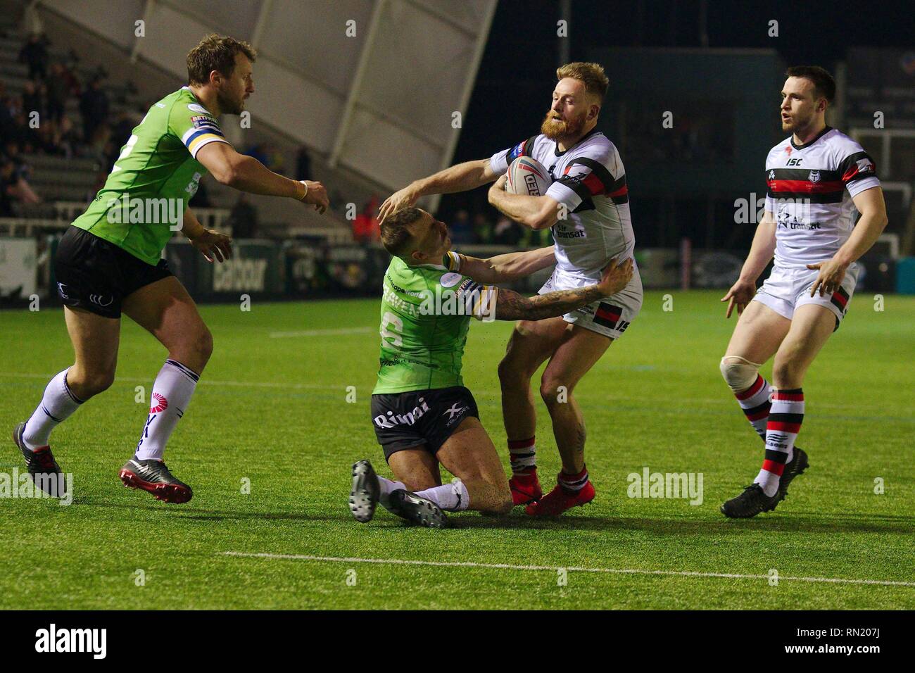 Newcastle upon Tyne, England, 16 February 2019. Danny Craven of Widnes Vikings attempting to tackle Gary Wheeler of Toronto Wolfpack during their Betfred Championship match at Kingston Park, Newcastle upon Tyne. Credit: Colin Edwards/Alamy Live News. Stock Photo