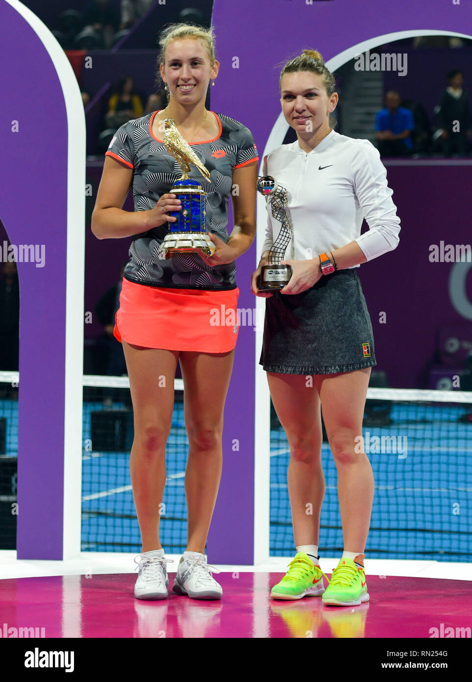 Doha, Qatar. 16th Feb, 2019. Elise Mertens (L) of Belgium and Simona Halep  of Romania pose with their trophies after the single's final match at the  2018 WTA Qatar Open in Doha,