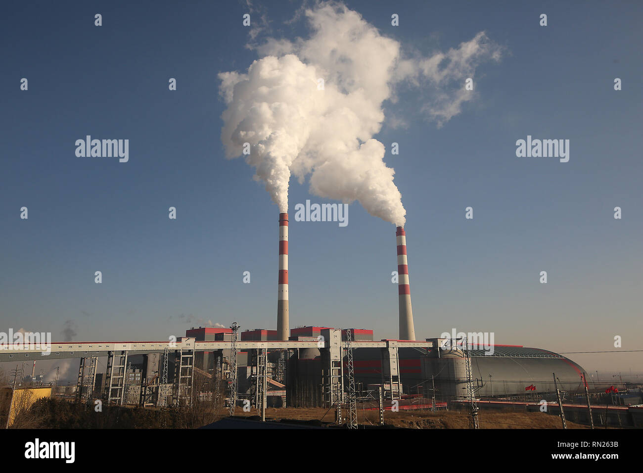 Smoke billows from a coal-powered electric power plant and industrial  facility in Datong, Shanxi Province (China's coal country), on December 12,  2018. China is the largest producer and consumer of coal in