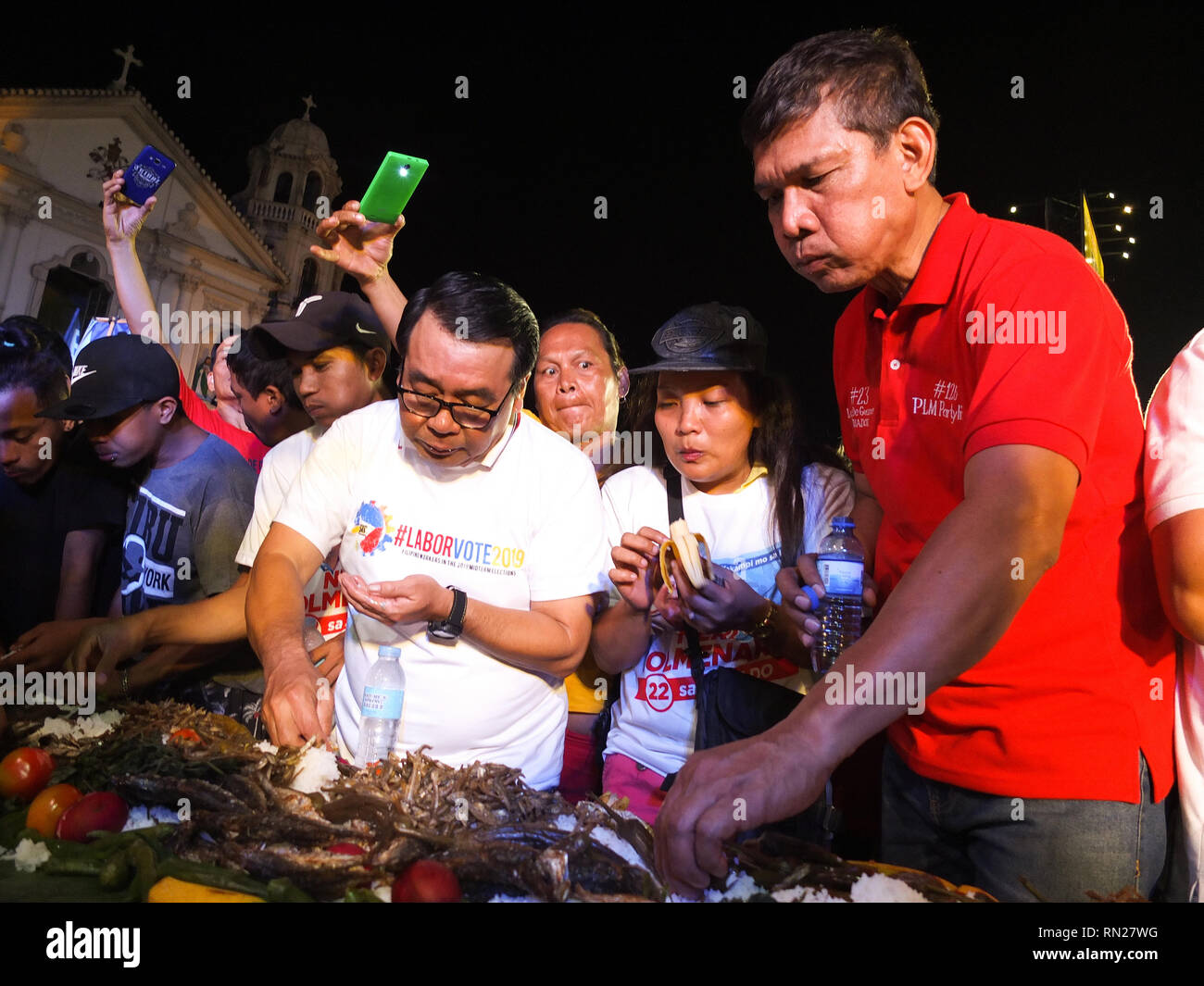 Former representative Neri Colmenares (L) and labor leader Leody de Guzman (R) participates in the boodle fight. 'Labor Win' a coalition of labor leaders running for Senate, said they are the only ones who have the 'real' credentials to push for pro-poor policies unlike other candidates for this year elections. the policial party 'Partido ng Lakas ng Masa' offers themselves as alternatives in this year's elections. They say they don't belong to either the administration or opposition Stock Photo