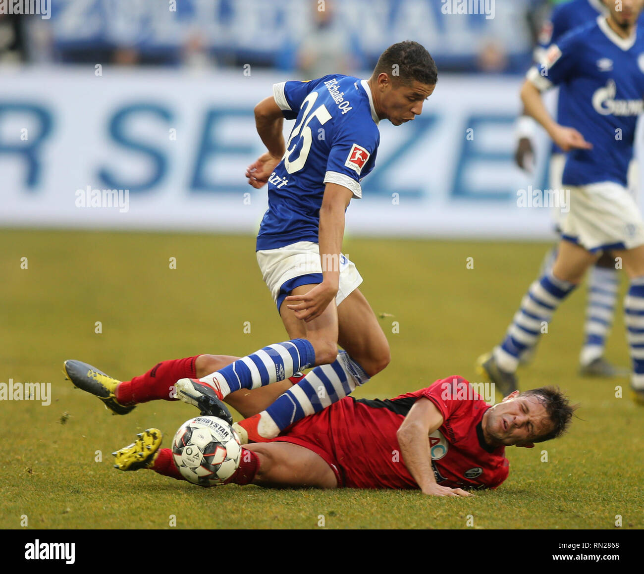 Amine Harit of Schalke 04, left, and Freiburg's Amir Abrashi are seen in action during the German Bundesliga soccer match between FC Schalke 04 and SC Freiburg at Veltins- Arena, Gelsenkrchen. ( Final score; SC Freiburg 0:0 FC Schalke 04 ) Stock Photo