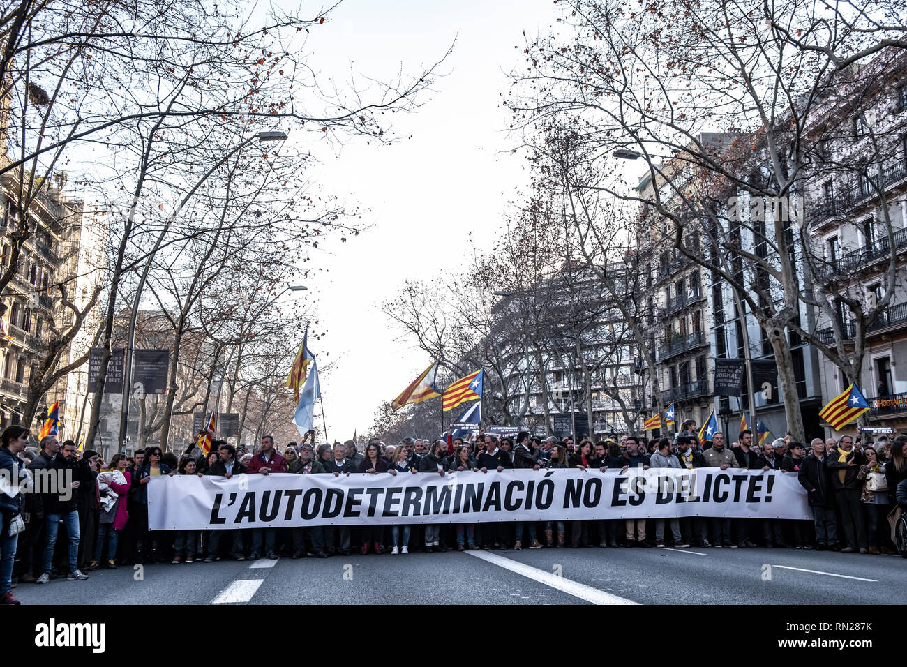 Barcelona, Spain. 16th Feb 2019. Demonstrators seen with a banner saying, Self-determination is not a crime, at Gran Vía during the protest. Summoned by the main sovereign entities ANC and Òmnium 200,000 people demonstrate in Barcelona against the judicialization of demands for self-determination and independence in Catalonia. Credit: SOPA Images Limited/Alamy Live News Stock Photo