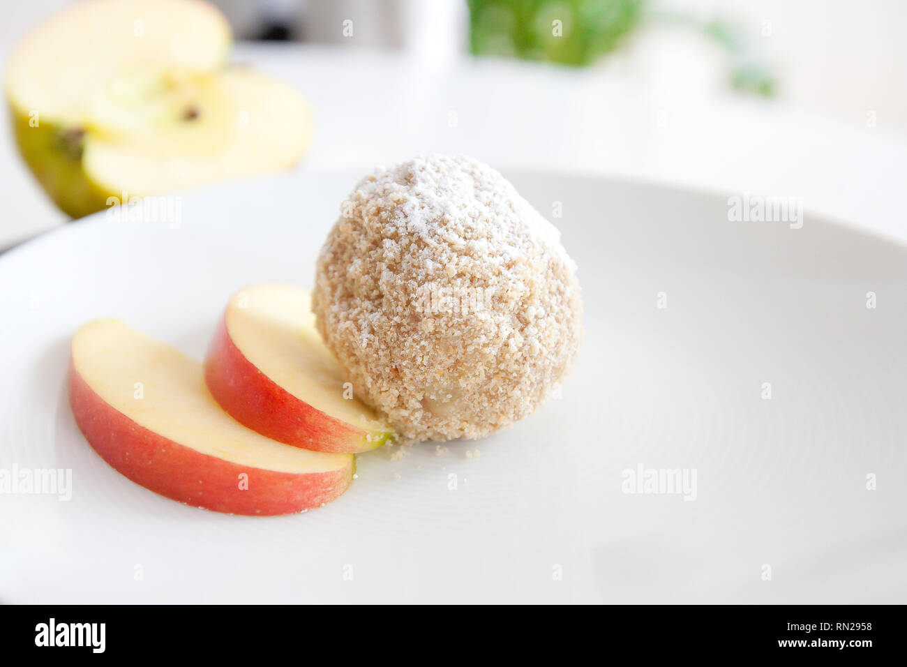 Potato dumplings with apple fullness photographed on white plate Stock Photo