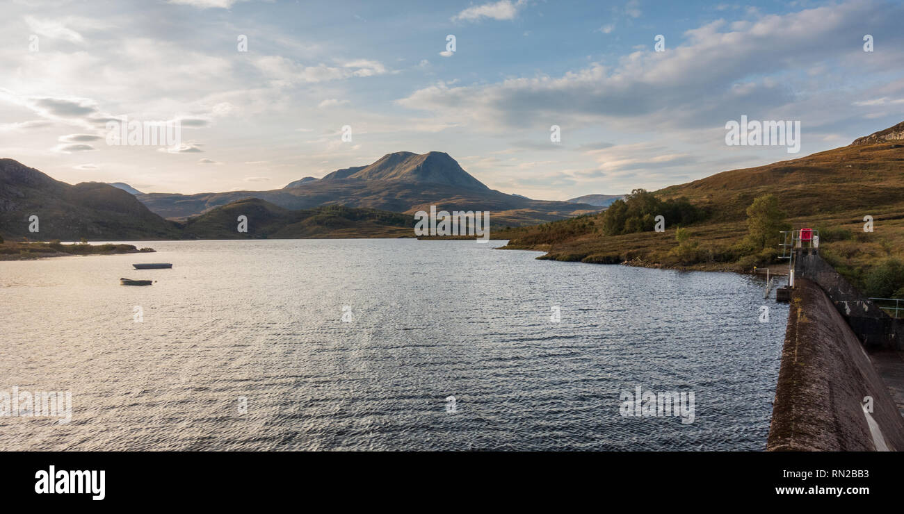 Row boats are moored in a reservoir under Baosbheinn mountain near Gairloch in the remote Northwest Highlands of Scotland. Stock Photo