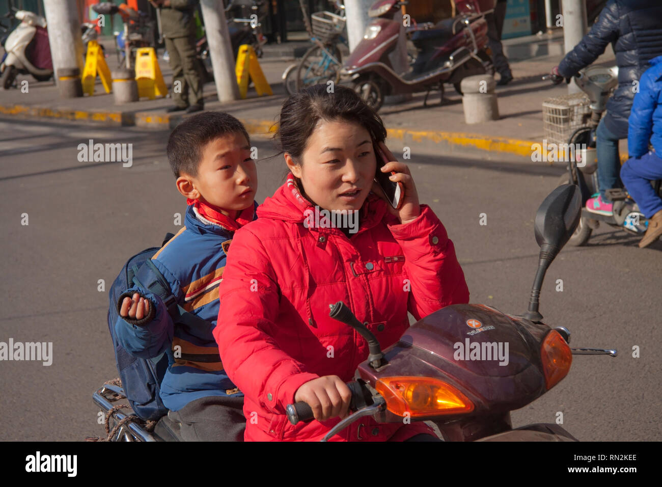 Child On Moped Asia High Resolution Stock Photography and Images - Alamy