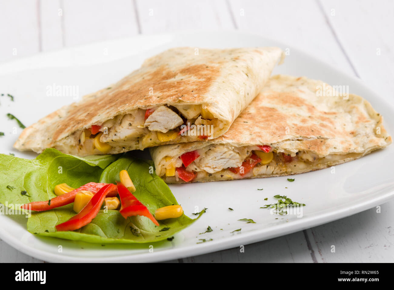 tasty fresh quesadilla with chicken meat and vegetables Stock Photo
