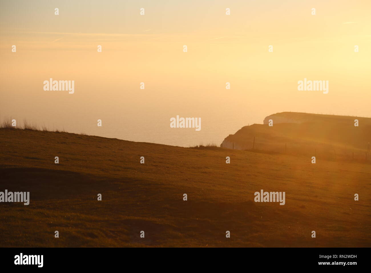 Beachy head cliff top at sunset Stock Photo