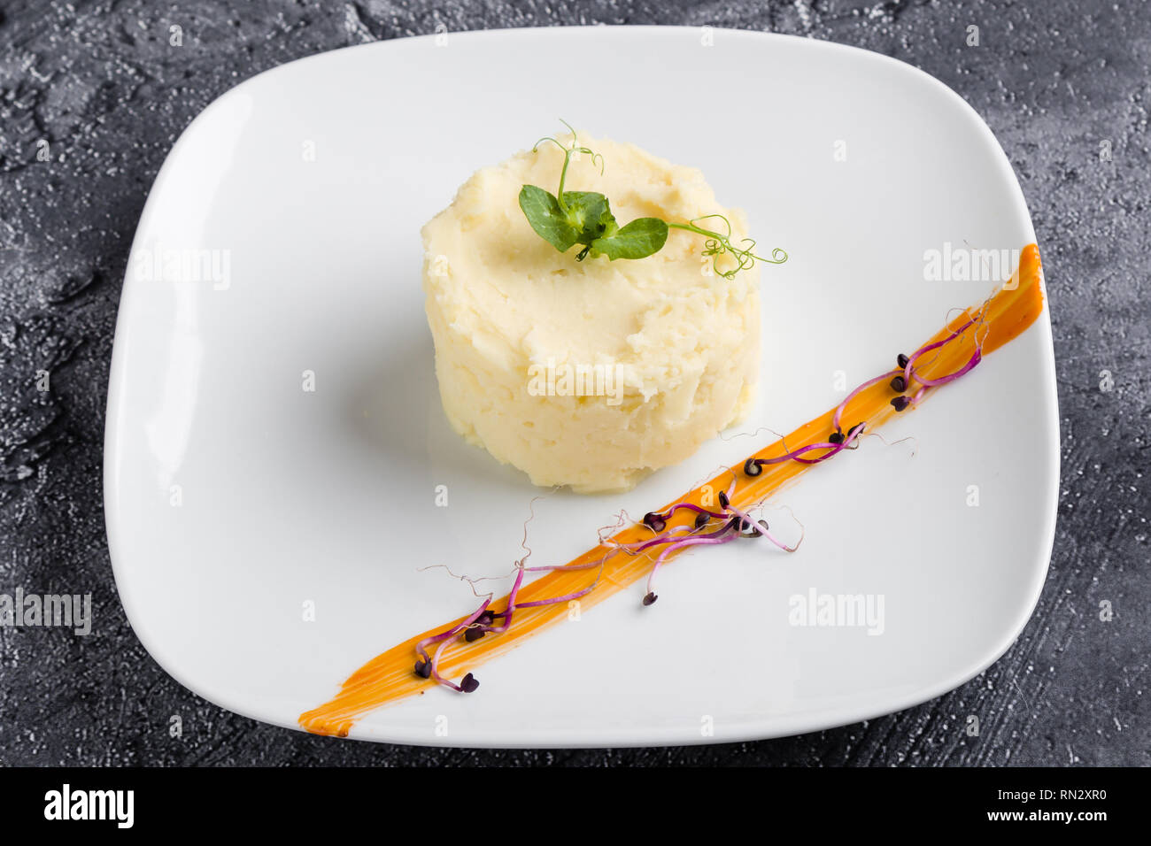 fresh mashed potato portion on white plate Stock Photo