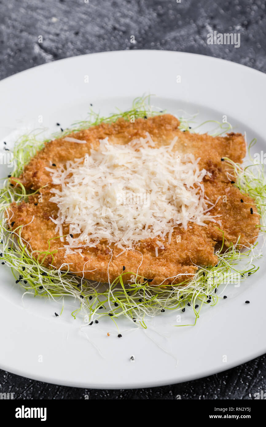 tasty delicious fried chicken schnitzel in restaurant setting Stock