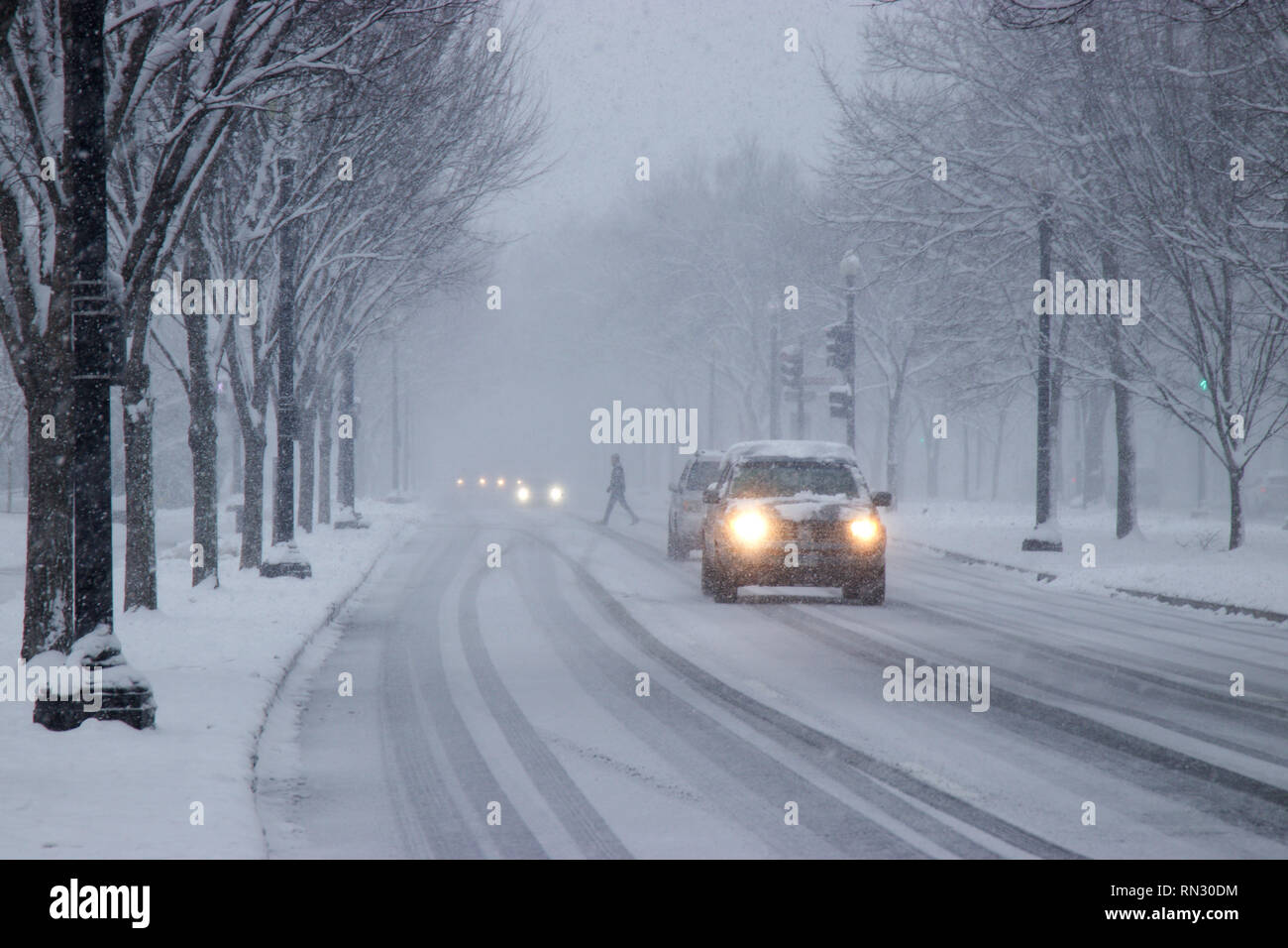 Car traffic on Independence Avenue in snow Washington DC USA Stock