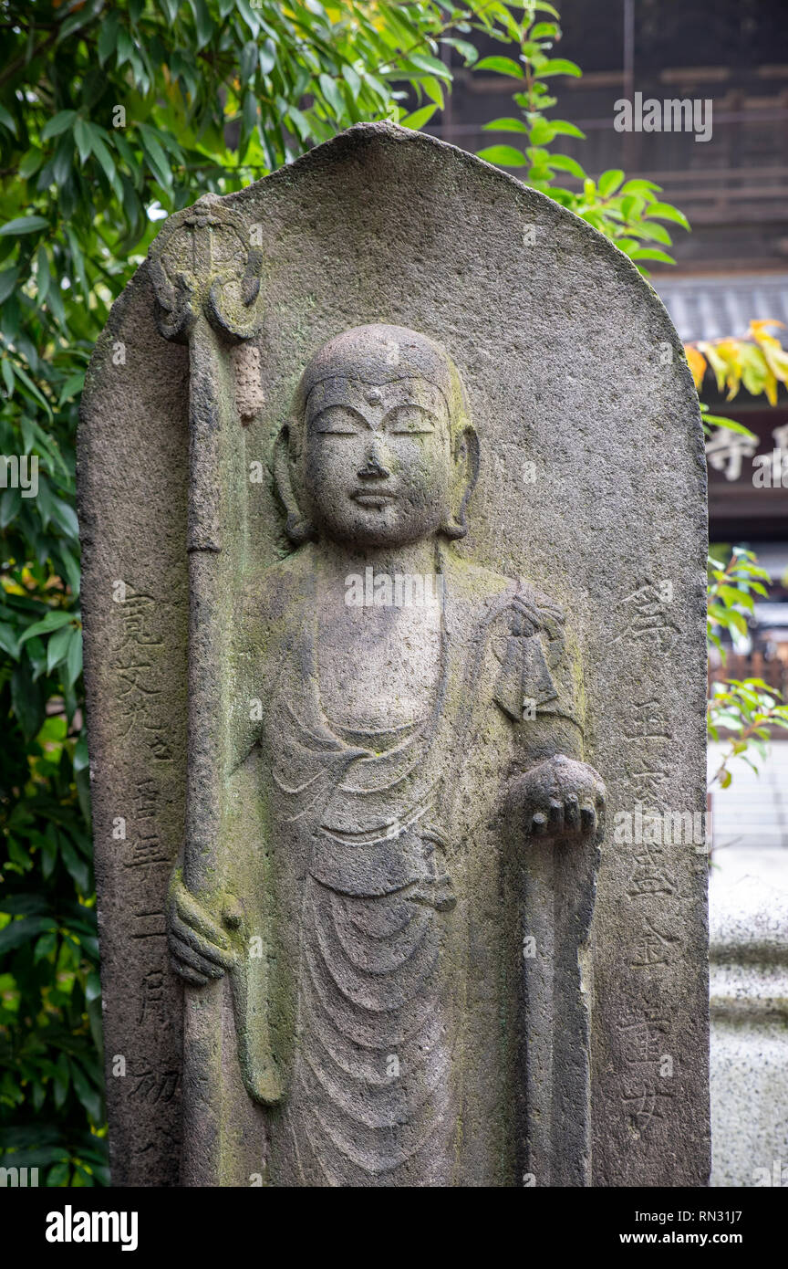 Stone fihures at the Sengakuji Temple, Tokyo, Japan Stock Photo