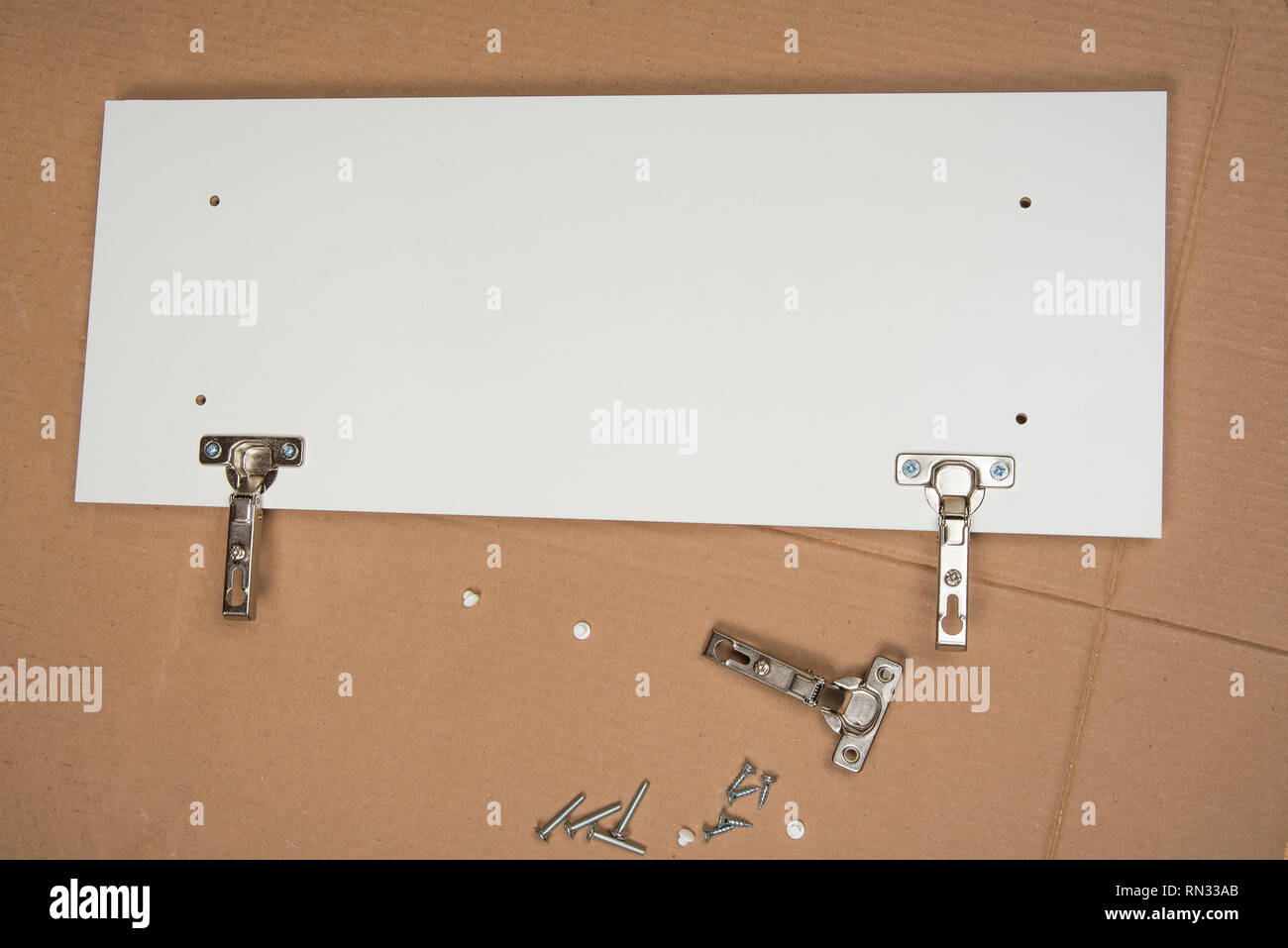 Handyman is assembling a Furniture put together concept Stock