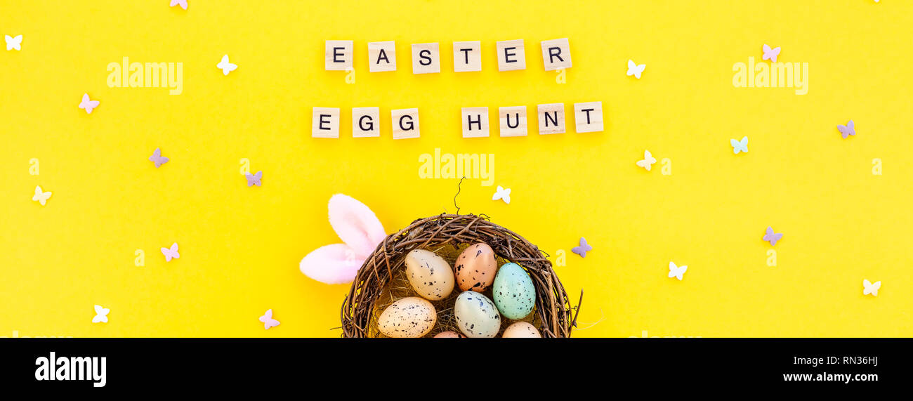Creative Top view flat lay holiday composition Easter bunny ears eggs ...