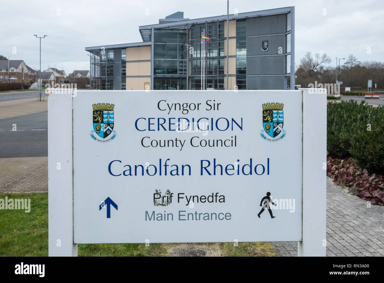Ceredigion,County,Council,main,offices,in,Aberystwyth,Ceredigion,Cardigan Bay,West,Mid,Wales,Welsh,bureaucracy,offices,U.K.,UK,GB,gay,pride,flag, Stock Photo