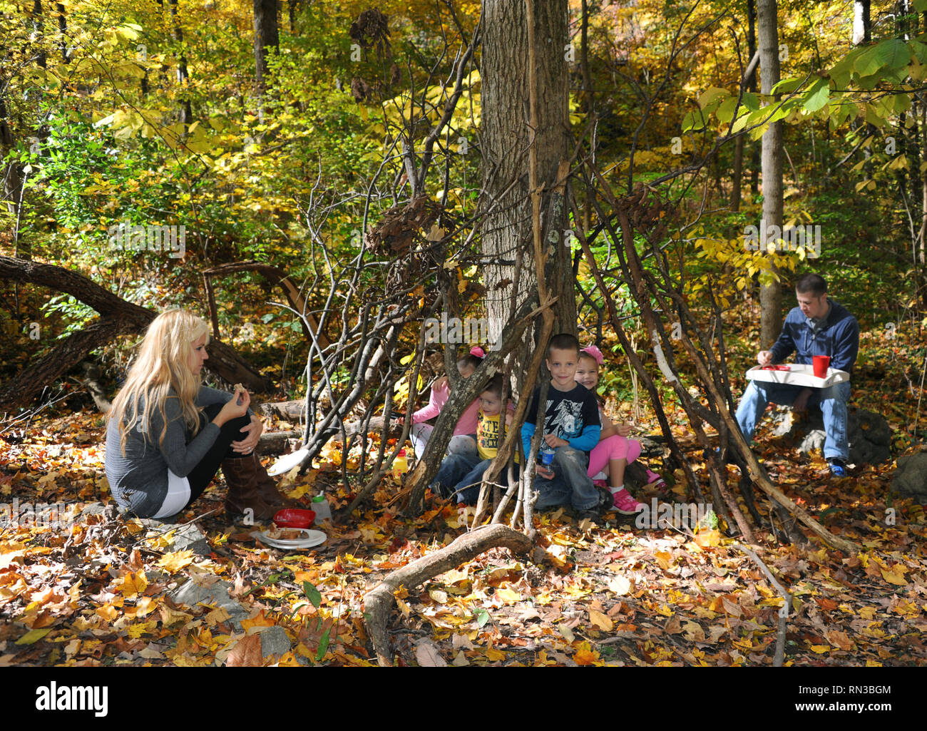 Family of six enjoy a rustic lunch as they camp in the Eastern part of ...