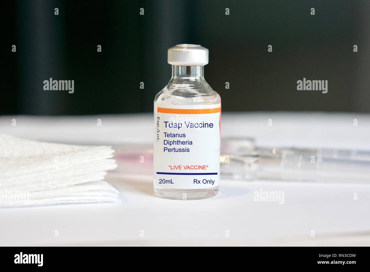 Tdap Vaccine for tetanus, diphtheria, and pertussis in a glass vial in a medical setting Stock Photo