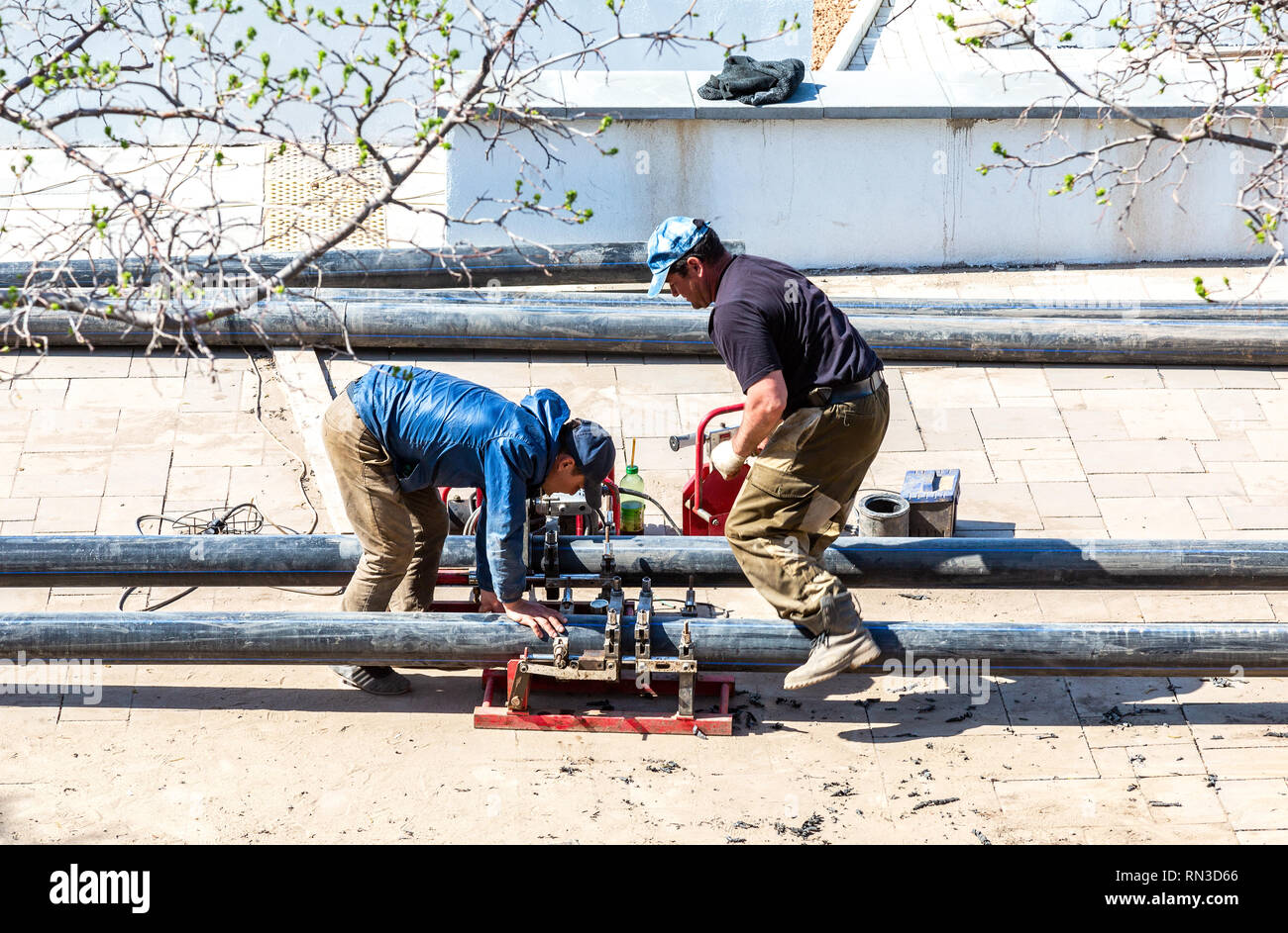 Samara, Russia May 6, 2018 Workers produce work of laying plastic