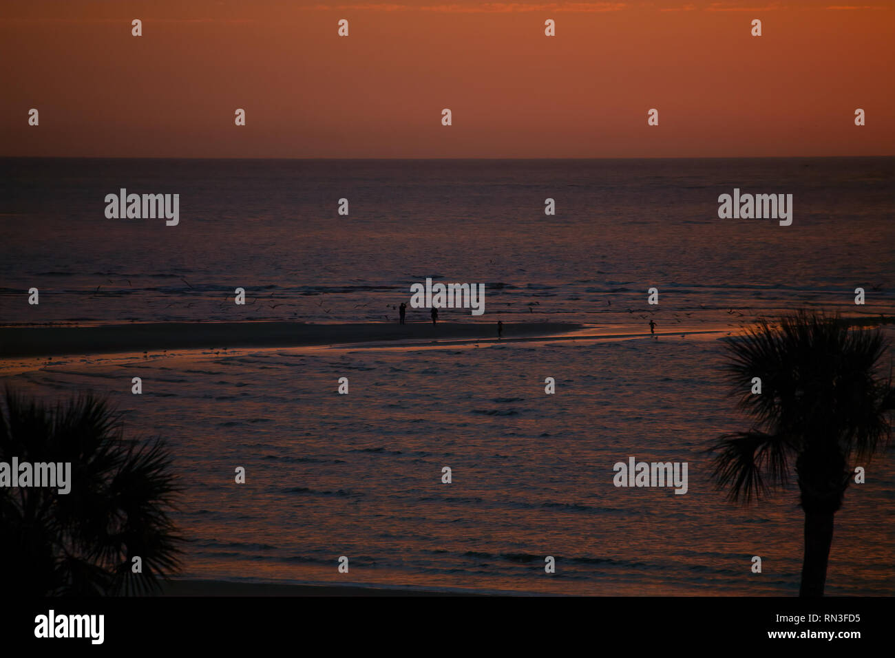 A brilliant sunrise in a tropical beach location Stock Photo Alamy
