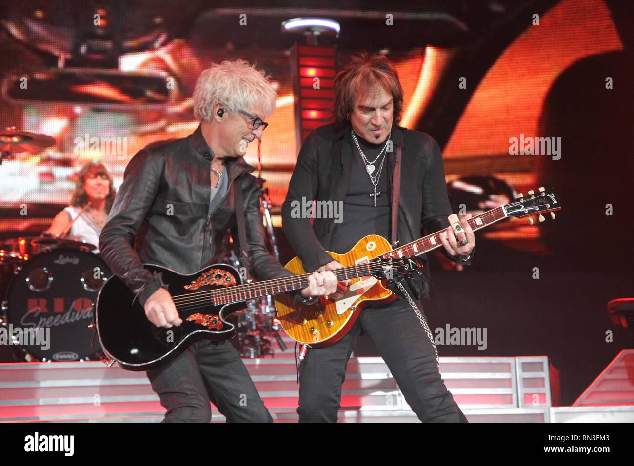 Band members of the rock band REO Speedwagon are shown performing on stage during a 'live' concert appearance. Stock Photo