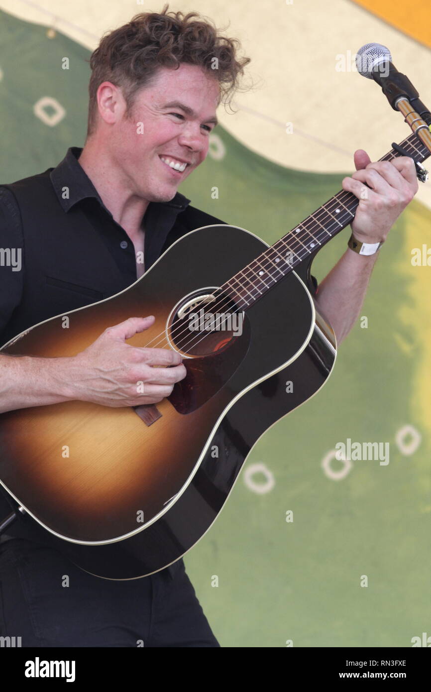 Singer, songwriter and guitarist Josh Ritter is shown performing on stage during a "live" solo acoustic concert appearance. Stock Photo