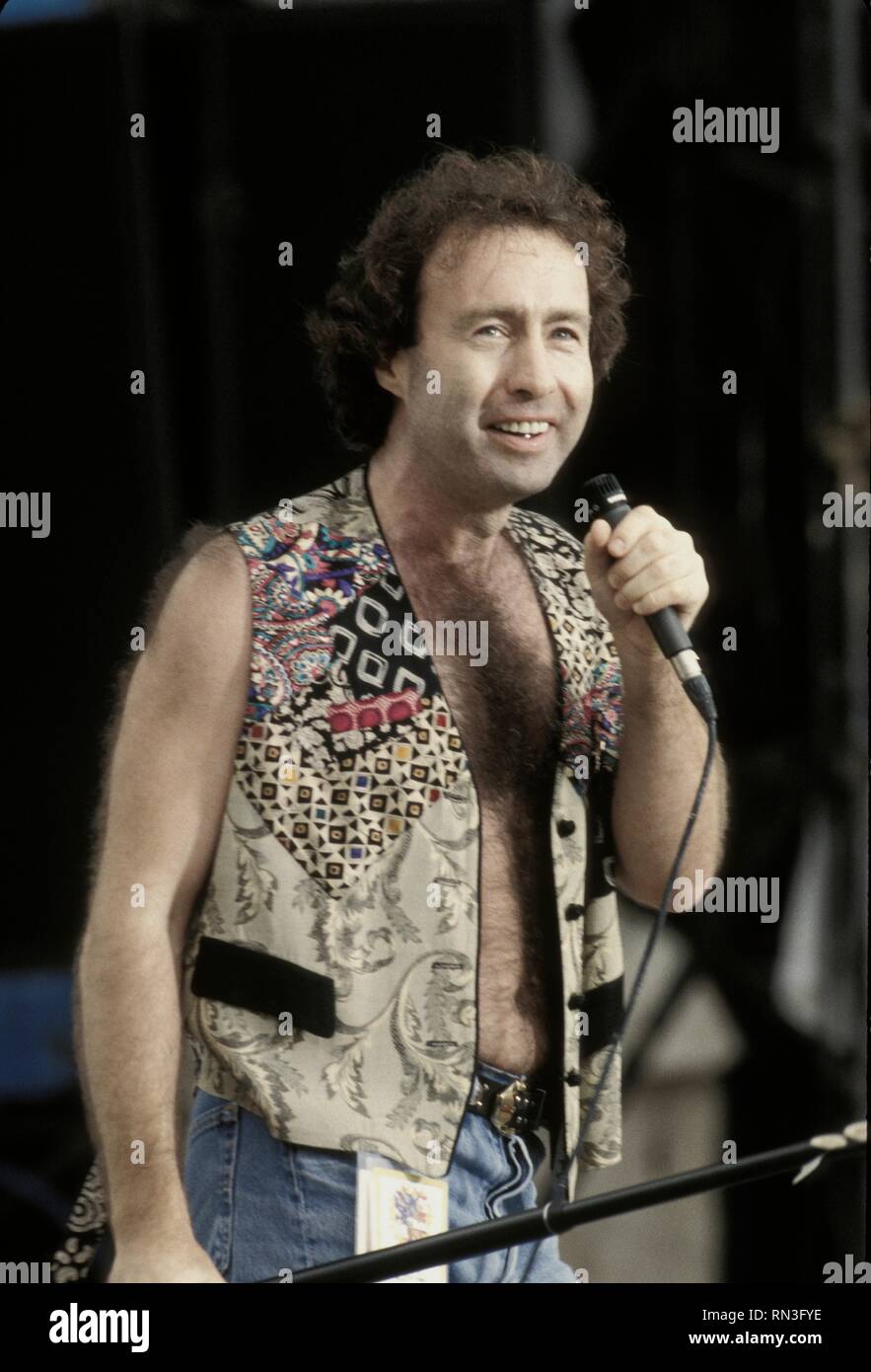 Rock singer and songwriter Paul Rodgers, best known for being a member of Free and Bad Company, is shown performing on stage during Woodstock '94. Stock Photo