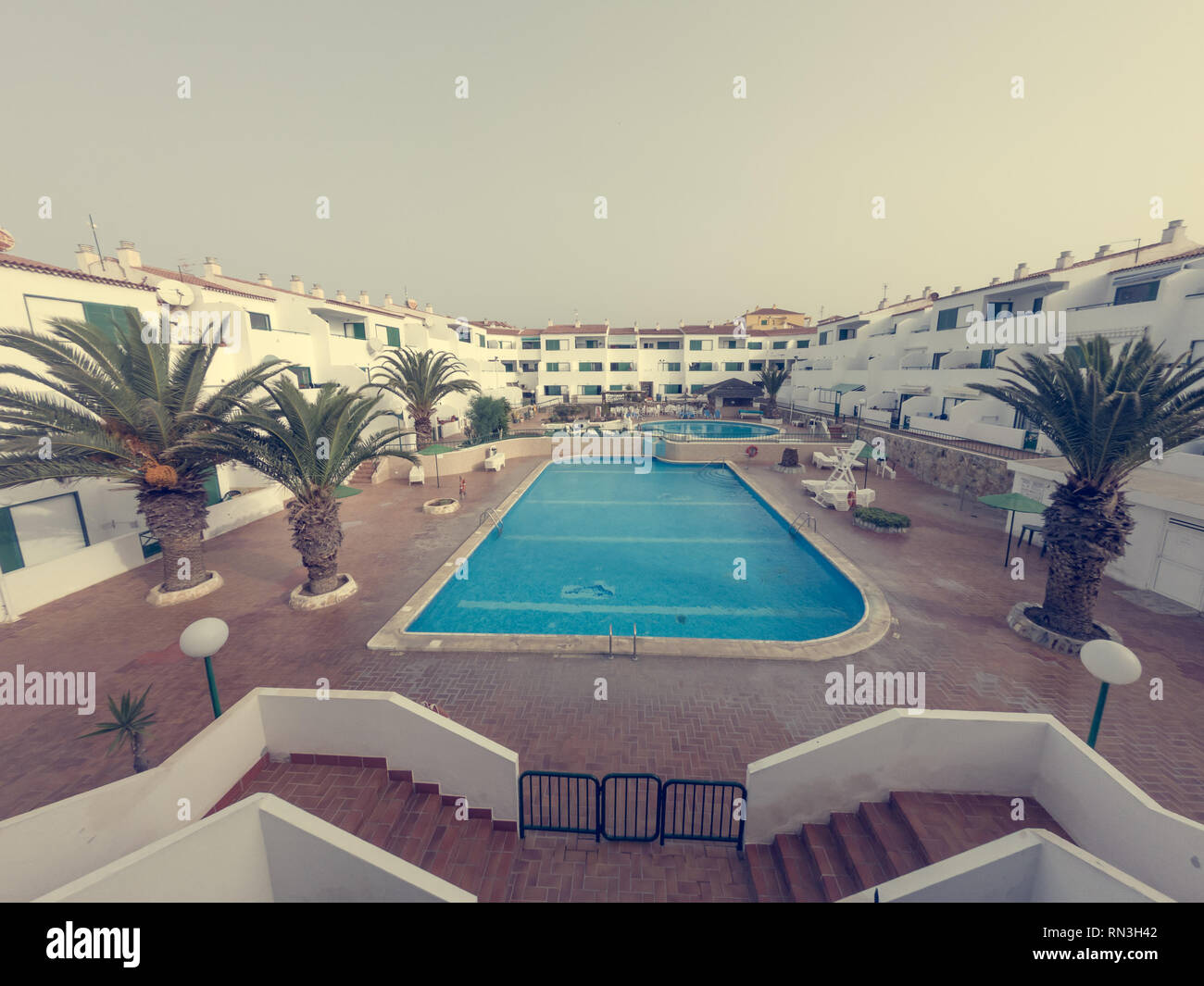 View of Tropical apartment complex with spectacular swimming pool Stock Photo ...