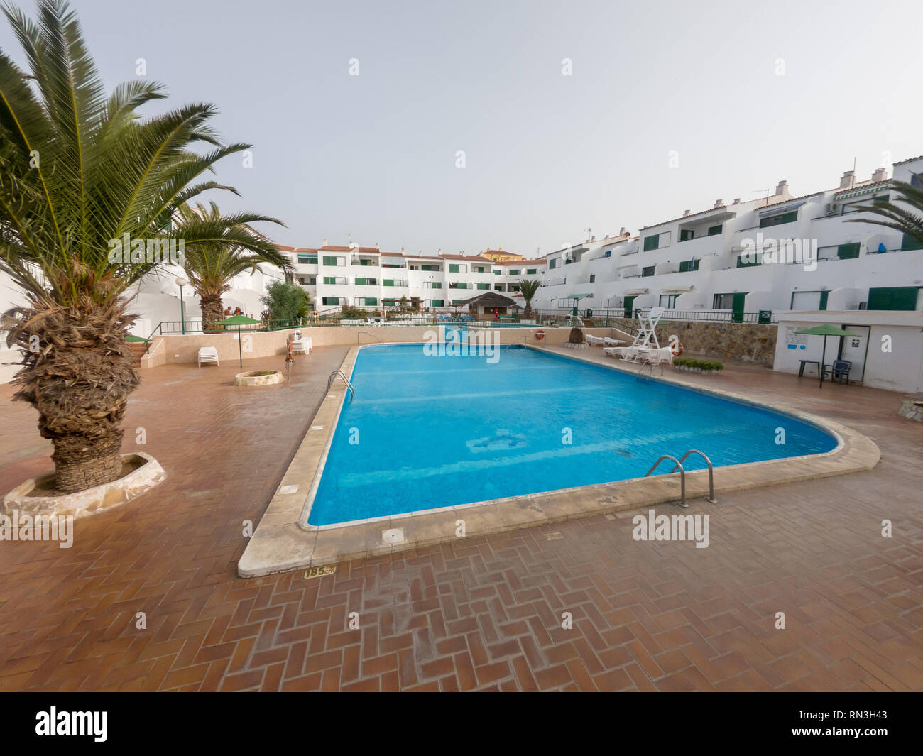 Picture of Tropical apartment complex with spectacular swimming pool Stock Photo ...