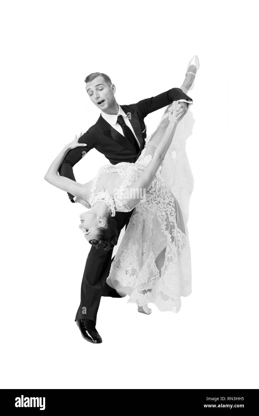 ballroom dance couple in a dance pose isolated on white background. sensual  professional dancers dancing walz, tango, slowfox and quickstep. Black and  white Stock Photo - Alamy