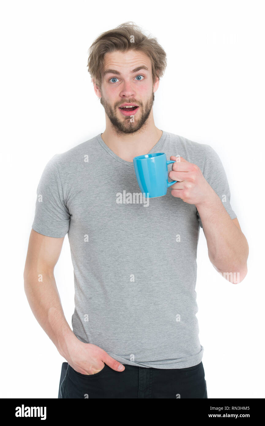 man or surprised guy drink from coffee or tea cup isolated on white