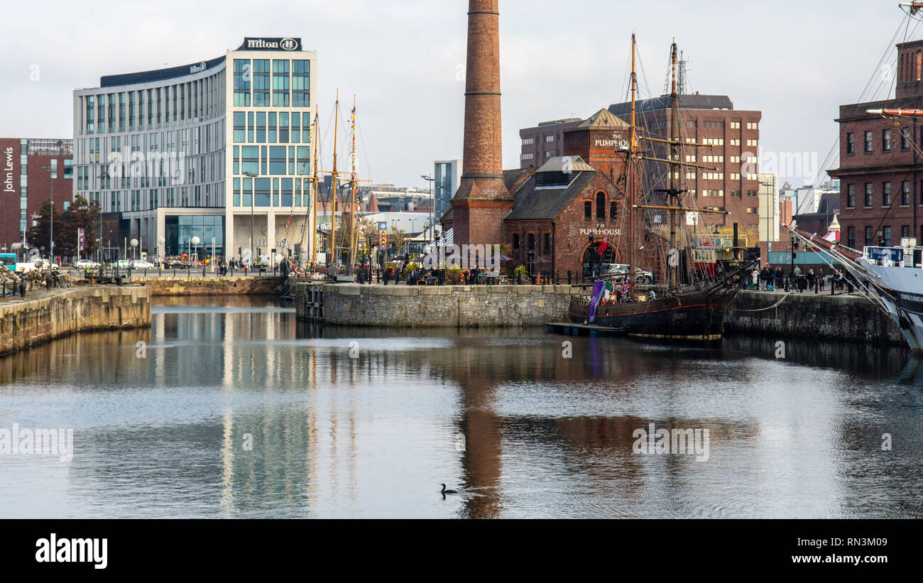 Liverpool, England, UK - November 4, 2015: Traditional sailing ships are docks in Canning Dock in Liverpool's regenerated docklands, with the Liverpoo Stock Photo