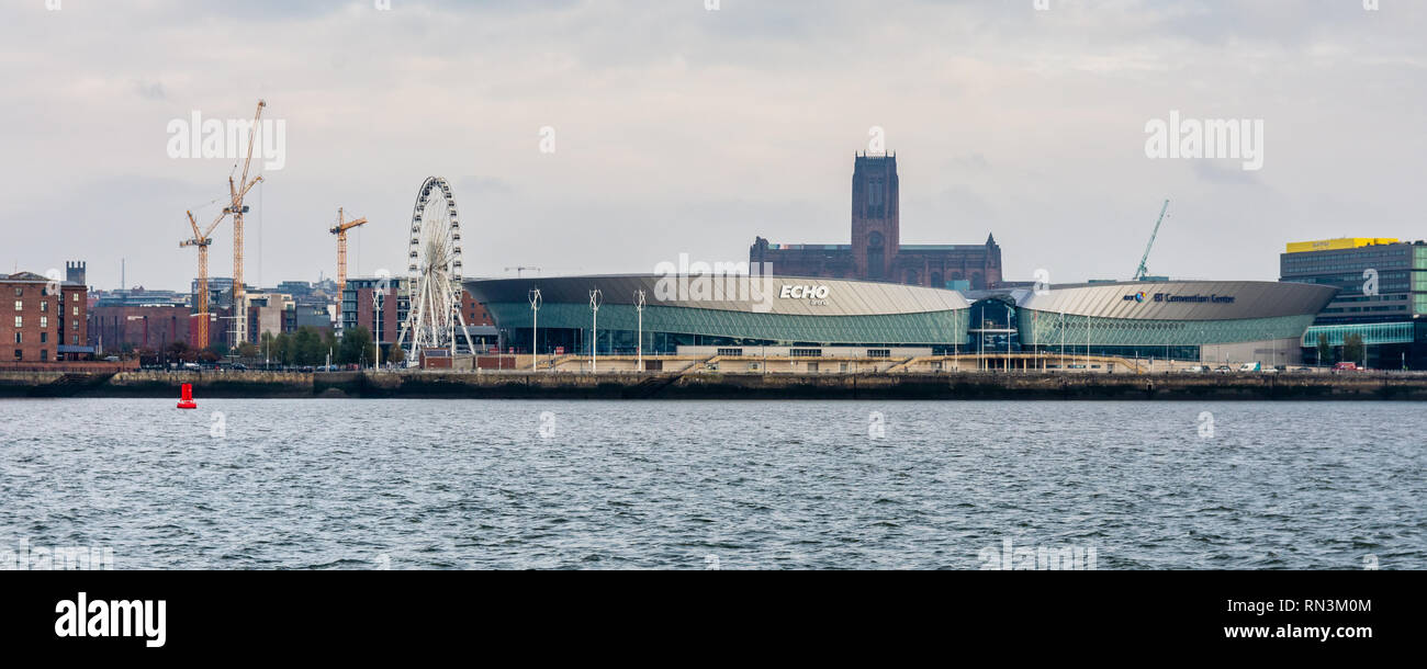Liverpool, England, UK - November 4, 2015: Liverpool's gothic cathedral tower rises from behind the Echo Arena and BT Convention Centre building on th Stock Photo