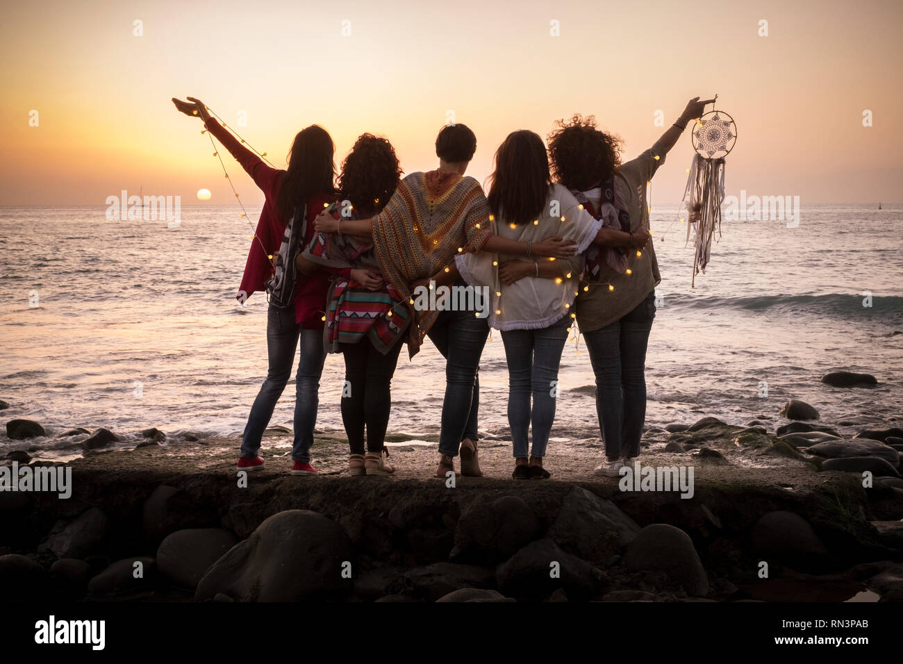 Dreaming image with group of females friends hug each other all ...