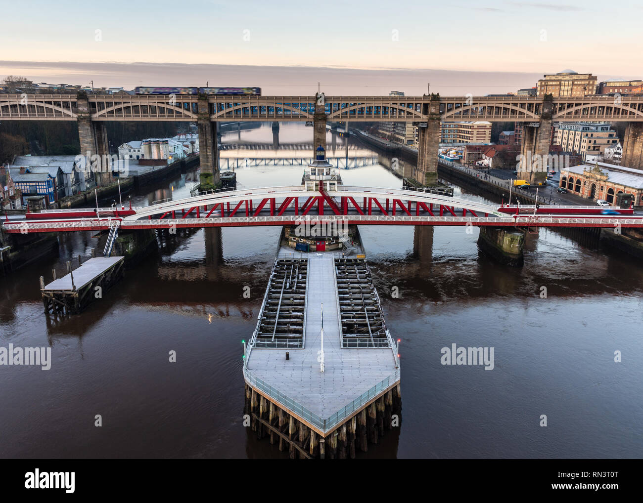 Newcastle, England, UK - February 5, 2019: A Northern rail diesel commuter train crosses the River Tyne between Newcastle and Gateshead on the High Le Stock Photo