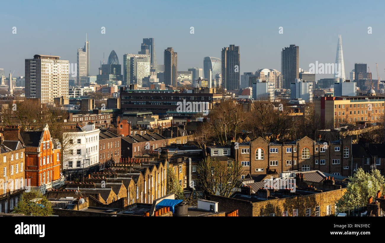 London, England, UK - March 27, 2017: Skyscrapers of the City of London financial district and high rise housing tower blocks of the Barbican estate r Stock Photo