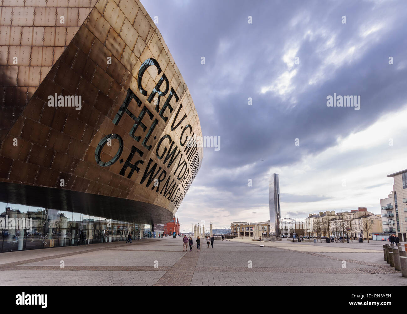 Cardiff, Wales, UK - March 17, 2013: The distinctive modern architecture of Cardiff's Millennium Centre theatre dominates Roald Dahl Plas in the city' Stock Photo