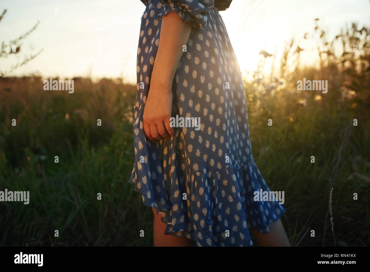 Woman in blue dress outdoors hi-res stock photography and images - Alamy